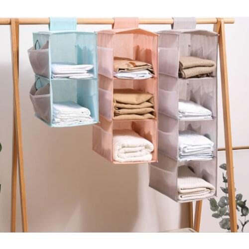 Hanging wardrobe storage rack Fabric hanging storage rack can be folded with side pockets for storing items