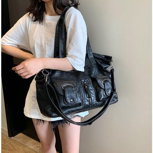 Women Big Soft Leather Bag 2020 New Punk Rivet Vintage Handbag Weekend Travel Bag Large Capacity Hole Clothing Business Bag Tote