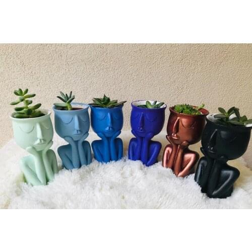 Hand on the flower pot