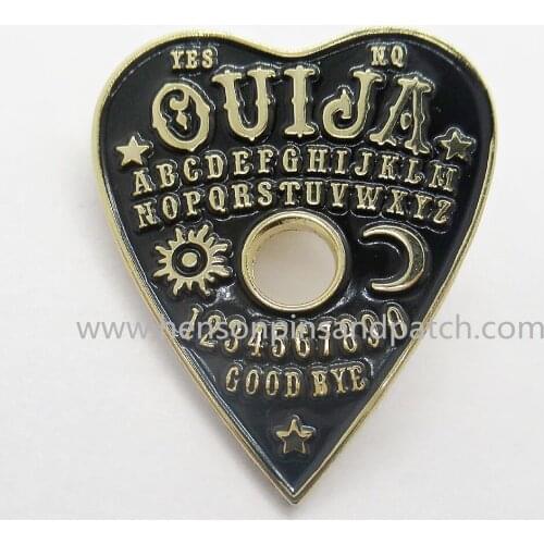 Retail and stock metal black soft enamel heart QUIJA badge