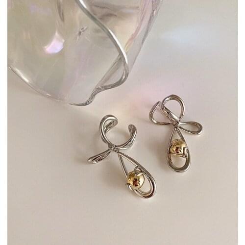 U-Magical Unique Design Hollow Out Bowknot Clip Earrings for Women Textured Gold Round Ball Contrasted Earrings Jewellery