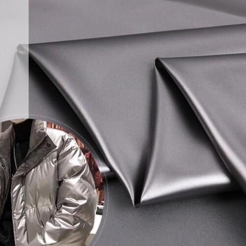 Wholese roll Shiny release paper down jacket fabric Bright PU waterproof and fleece Metallic polyester pongee cotton coat fabric