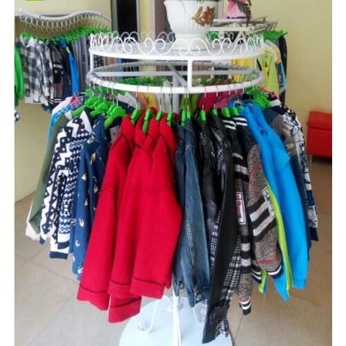 High - end childrens clothing store shelves clothing rack wrought iron circular rotating hangers display shelf island shelf flo