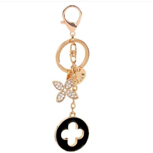 JINGLANG New Fashion Four-leaf Rhinestone Clover Keychain Exquisite Metal Car Girl Wallet Pendant Trinkets Gifts