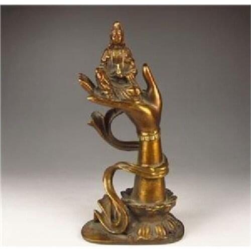 Decorative old bronze sculpture of the goddess of mercy Buddha sitting on hand
