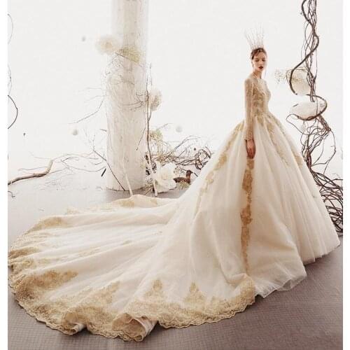 2020 Vintage Long Sleeves Gold Appliqued A-line Puffy Wedding Dresses Dubai Arabic Luxury Beaded V Neck Sweep Train Bridal Gown