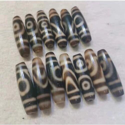 1pcs/lots Natural high-quality Tibetan old dzi beads Tooth yellow rare precious classic pattern Weathered Ancient Precious diy