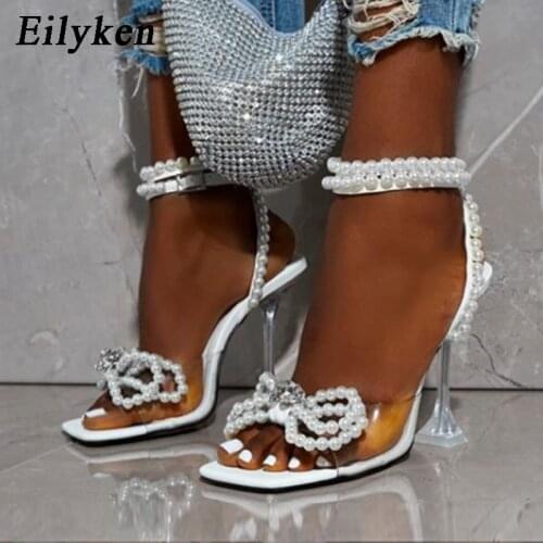 Eilyken New Women Sandals 2021 Summer Sexy Perspex Crystal High Heels Party Wedding Shoes Square Toe Pearls String Bowknot Pumps