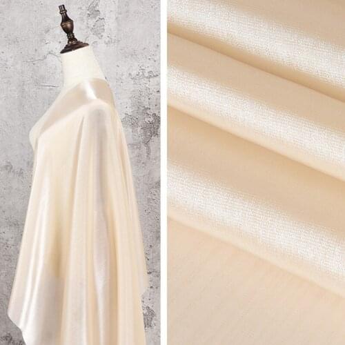 Champagne pearl yarn cationic illusion color mesh fabric fashion shirt dress fashion high-end design fabric