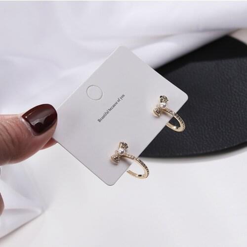 2020 Korean Version Of Punk Phoenix Earrings Fashion New Bow Pearl Temperament Ladies C-shaped Small And Simple Korean Earrings