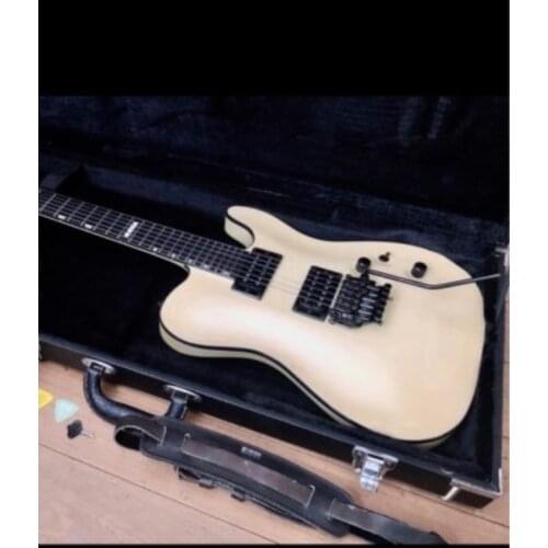 Customized electric guitar special body and headstock shape. mahogang body.maple neck.sert in joined .locking tremolo and nut