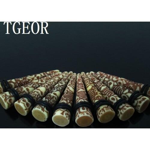 100% New 1 pair Carving multi skulls light coffee ear expander resin straight ear taper free shipping