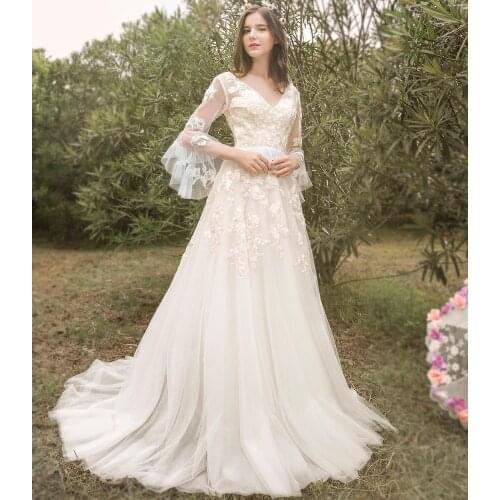 A Line V Neck Wedding Dress Trumpet Long Sleeves Open Back See Through 2021 Floral Appliques Tulle Garden Bridal Gowns 1206