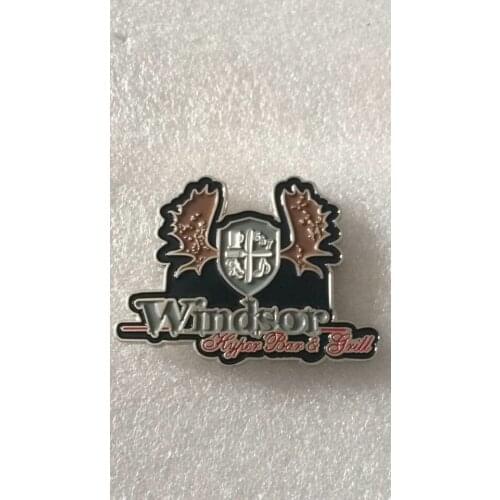 Custom die struck metal pins with magnet backer