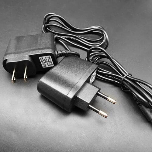 1PCS High quality AC/DC 9V 1A Switching Power Supply For guitar foot pedal Effect adapter Reverse Polarity Negative Inside