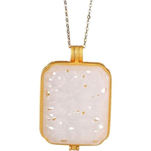 S925 sterling silver gold plated natural Hetian Jade white jade pendant personality retro hollow pattern perfume bag pendant