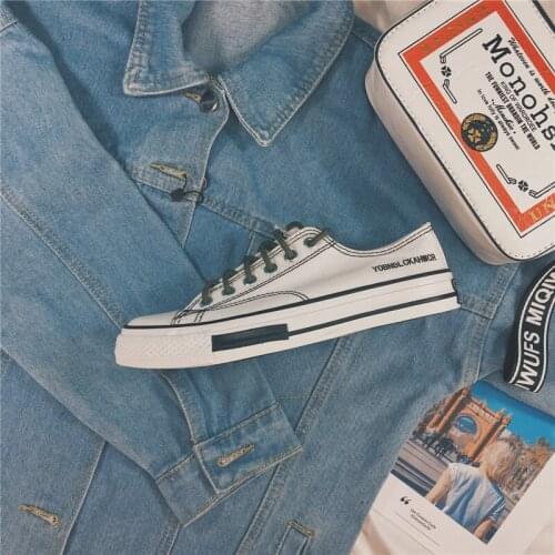 Korean version of the new solid color lace flat canvas shoes womens student shoes