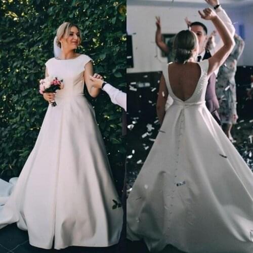 Elegant Boho Garden Wedding Dresses Satin Jewel Neck Cap Sleeve A Line Bridal Gowns Sexy Backless Sweep Train Robes De Mariee