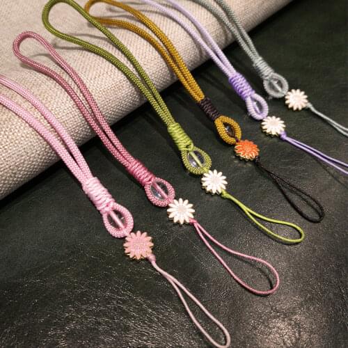 Mobile phone lanyard short hand-woven mobile phone case wrist chain small daisy pendant with pendant key u disk anti-lost rope