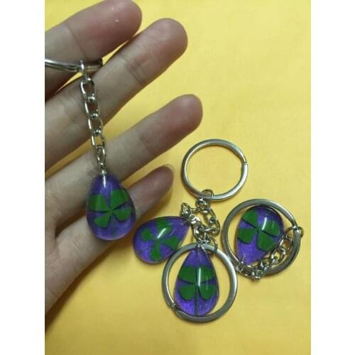 FREE SHIPPING 10 pcs real four leaf clover noble purple drop shape magic keychain