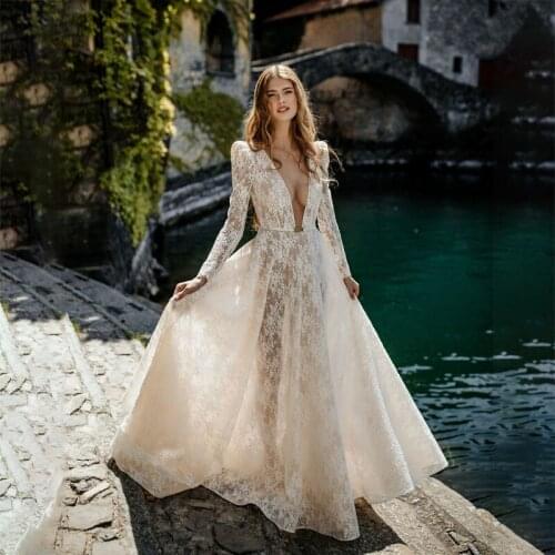 Sexy Deep V Neck Lace Wedding Dress Champagne Illusion Long Sleeves Beach Country Bridal Gowns with Belt Backless Bride Dresses