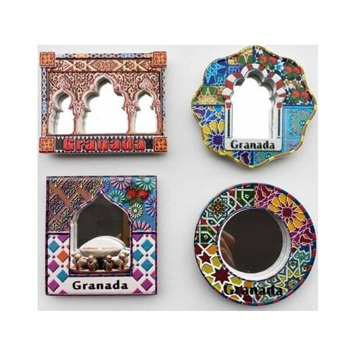Hand-painted fridge magnet stickers with carved stone columns at the Alhambra Palace in Granada, Spain