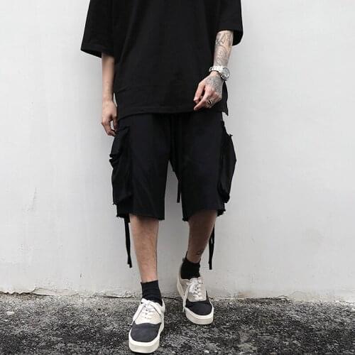 Kanye high street style pocket streamer low crotch drawstring five-point pants European and American hip-hop style raw edge l