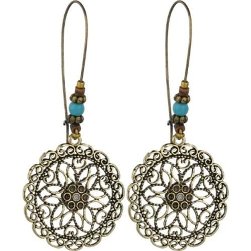 XIAONIANSHI Bohemia Ethnic Vintage Style Hollow Metal Sun Flower Pattern Simple Round Pendant Long Earring Women Jewelry