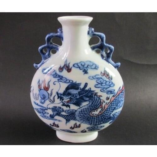 Antique Chinese blue and white porcelain dragon on both sides. The vase