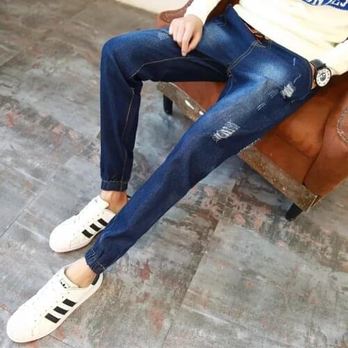 Wholesale 2020 teenagers Mens ripped hole trousers jeans Korean style trendy slim feet loose casual hip hop harem pants men