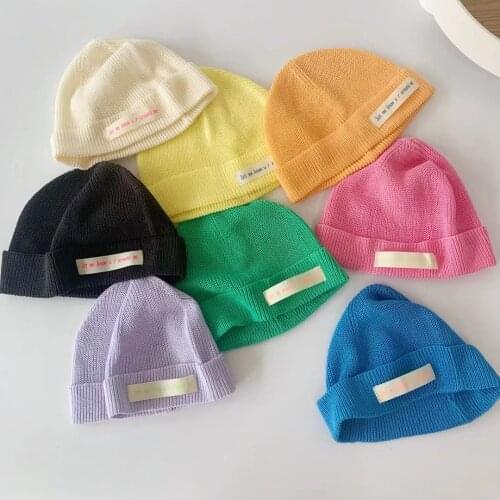 New Fashion childrens cloth label knit hat baby autumn and winter new wave Korean version of candy color solid color wool cap
