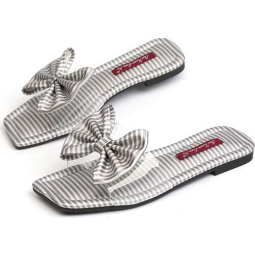 Sweet big bow transparent slippers women flat stripe sandals new designer bow knot clear flip flops women beach slides shoes