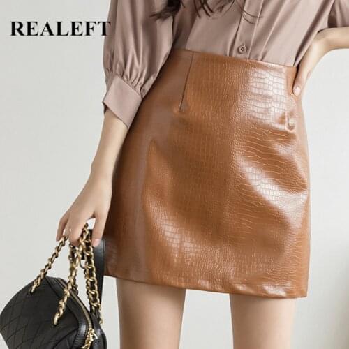 REALEFT Winter Womens PU Leather Skirts 2021 New Stylish Fashion Solid Mini Skirts High Waist Wrap Short A-Line Skirts Female