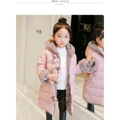 A long winter childrens coat with childrens wear and cotton padded jacket