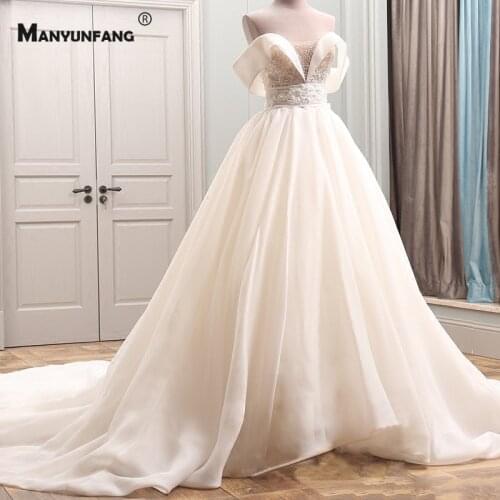 2021 New Arrival Off the Shoulder Cathedral Train Bridal Ball Gown Custom Made Pearls Crystal Boat Neck Zipper Wedding Dress