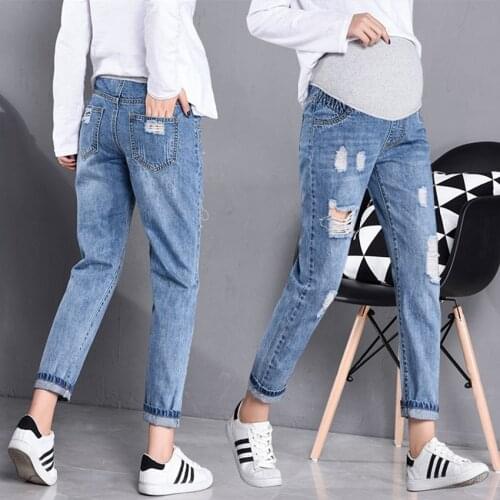 Spring and autumn models pregnant women jeans spring new wave mother Korean hole loose pregnant women trousers