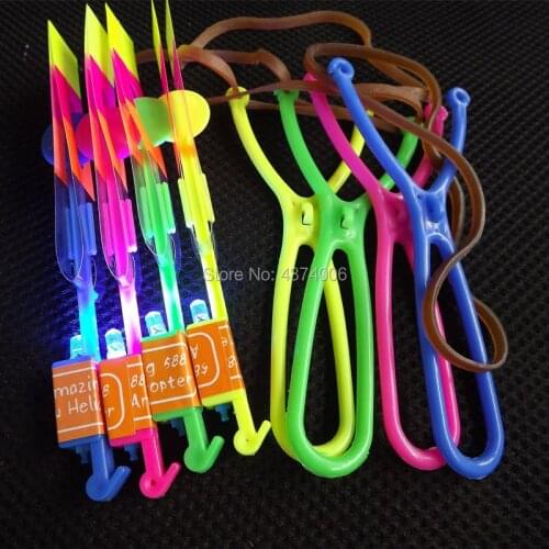 10pieces/lot) Rubber Band Slingshot Helicopter with LED Light Flashing Flying Arrow