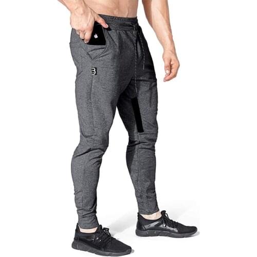 Spring and Autumn New Mens Sports Pants Running Pants Mens Fitness Jogging Pants Slim Fit Leisure Solid Color Pants