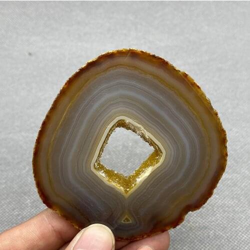 Natural agate slice polished ore specimen with crystal hole