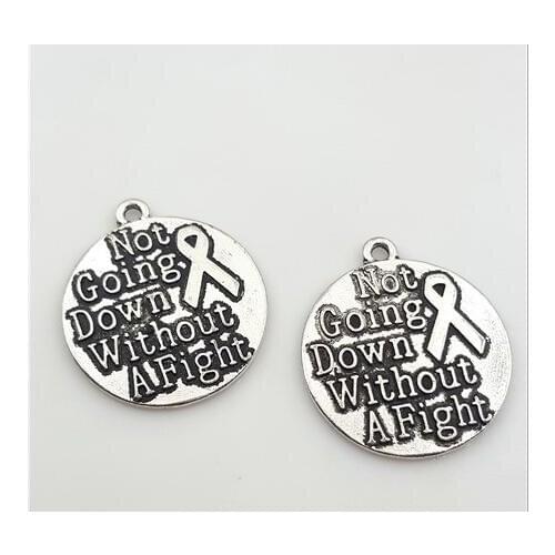 High Quality 20 Pieces/Lot Diameter 25mm Letter Embossed Not Going Down Without A Fight Breast Cancer Awareness Charm Pendant