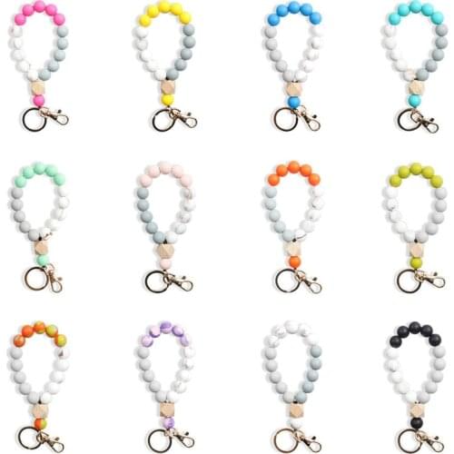 Julie Wang 1PCS Silicone Keychain Silicone Wood Beads Bracelet Key Chain Keyring For Men Women Anime Car Bag Accessory Decor