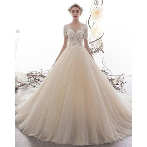 New Arrivals V-neck Lace Up Back Short Sleeve Beading Appliques See Through Illusion Wedding Dress A Line Alibaba China
