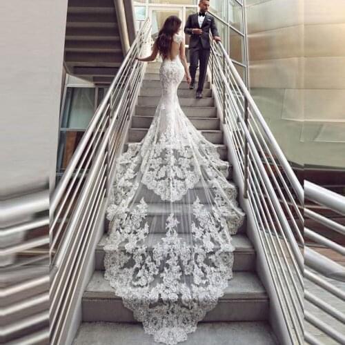 Luxury Beaded Mermaid Wedding Dresses 2020 Sweetheart Cap Sleeve Backless Long Tail Applique Lace Button Back Bride Dress