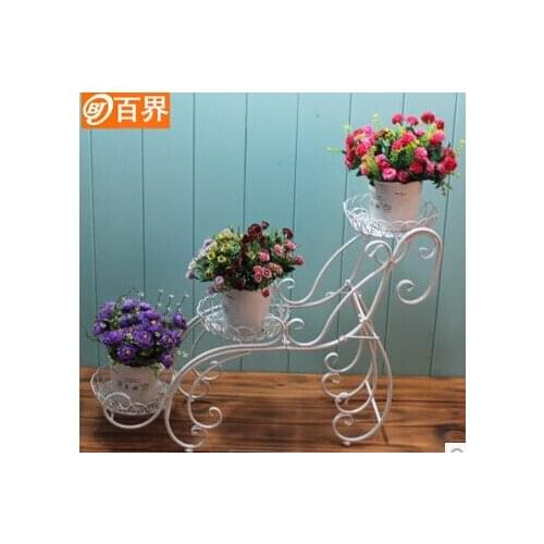 European-style balcony and indoor living room three layer shelf floor a few flowerpot wearing flower gardening