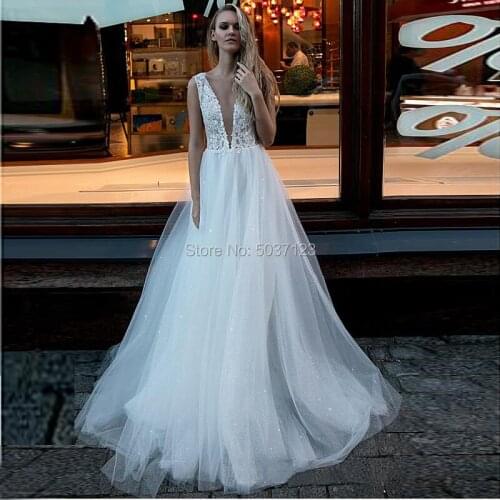 Sparkling Sleeveless A Line Wedding Dresses Vestido De Noiva Lace Appliques Deep V Neck Court Train Button Wedding Bridal Gowns
