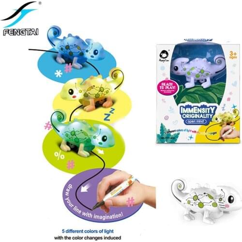 The line-sensitive chameleon toy will glow and change color according to the black line trajectory and the magic pen will walk