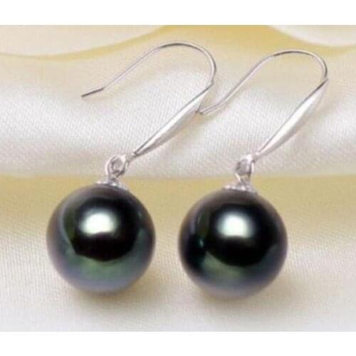 A pair of natural 11-12mm tahitian black green pearl earrings 14K/20 White Gold