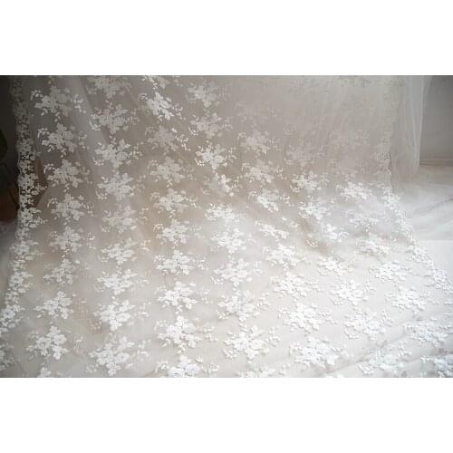 Embroidery lace flowers with lace trim fabrics. bridal dress full piece lace fabric