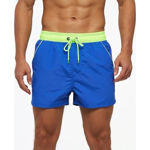 Mens beach shorts quick-drying solid color pants Triangle Mesh lined swimming trunks European and American beach surf shorts