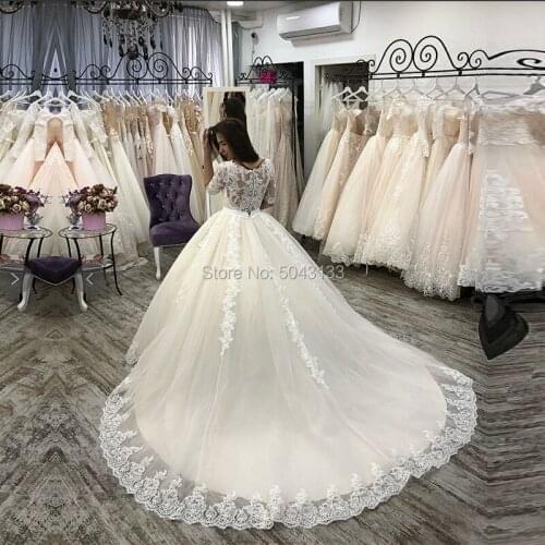 Luxury Champagne Wedding Dresses with Beaded Sash Romantic Lace Appliques Sheer O Neckline Half Sleeves Bridal Gown Formal Bride
